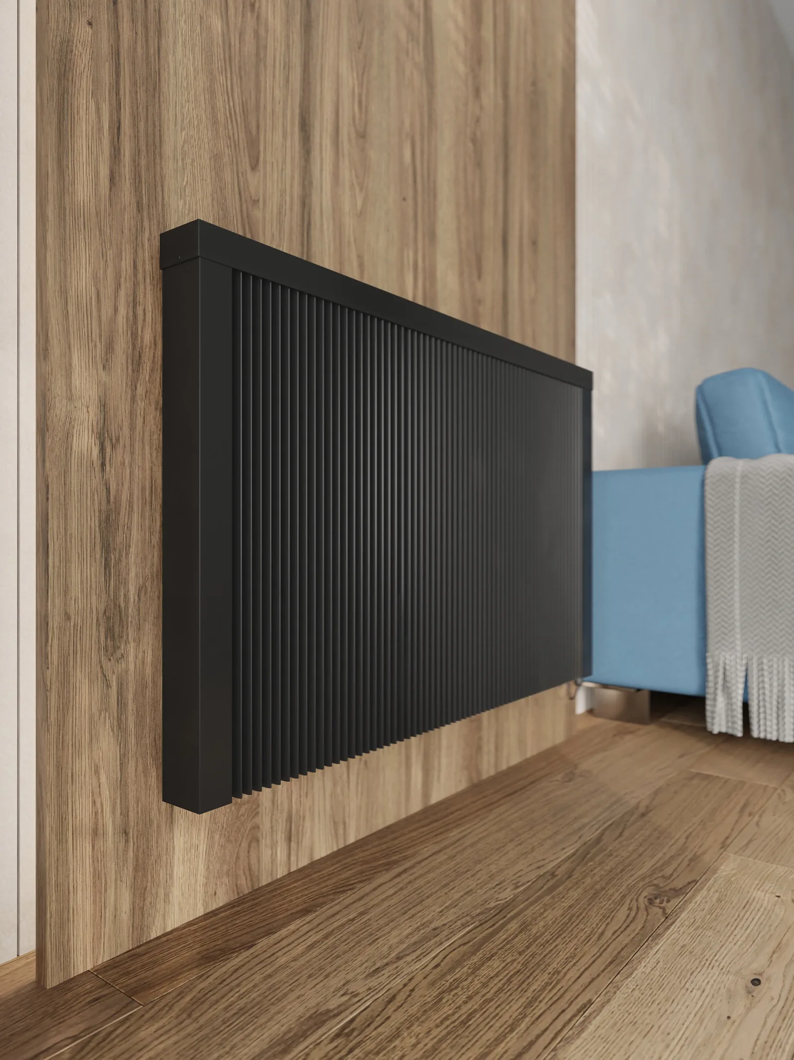 Anthracite radTherm CHM electric radiator mounted on a wood-panelled wall